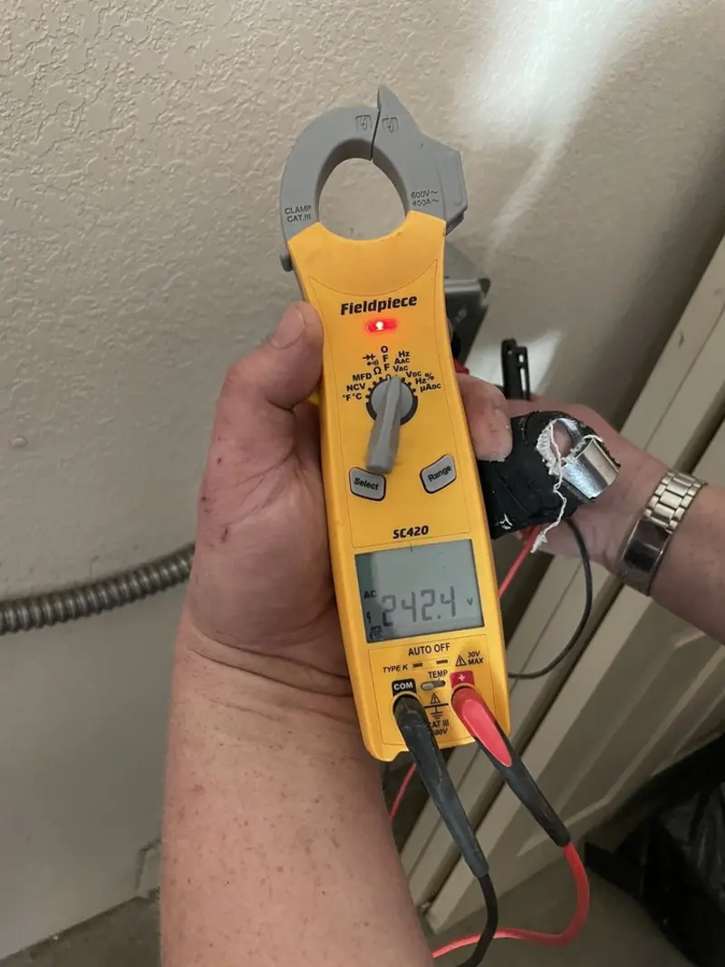 Voltage testing with clamp meter during Recessed Lighting Installation in Joplin